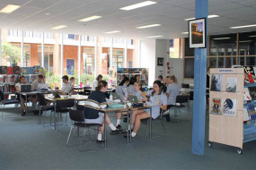 Students at desks in library