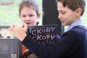 Year 6 students reading to juniors 2
