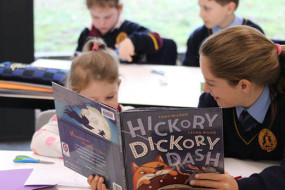 Year 6 students reading to juniors 1