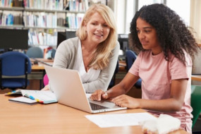 Librarian helping student with research