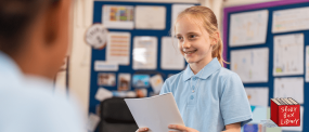 School Student reading to her class 