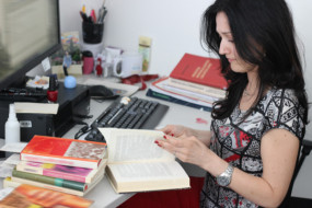 Teacher Librarian selecting books