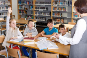 Teacher librarian with students